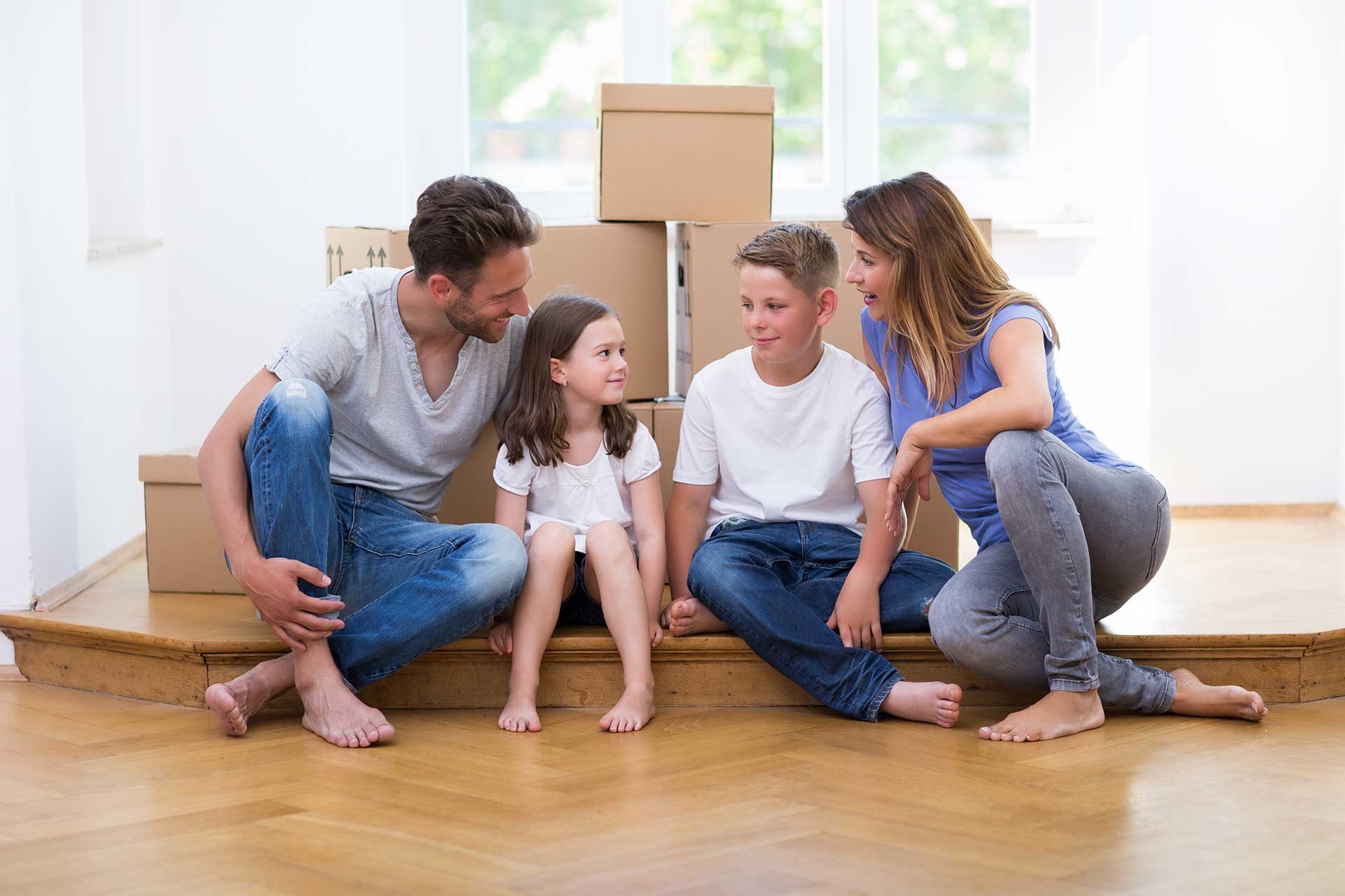 photo of a family moving home and happy
